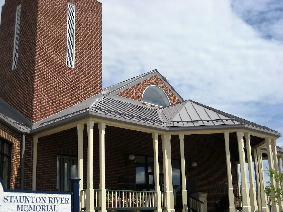 Skilled roofing craftsmen working on a residential roof in Cumberland